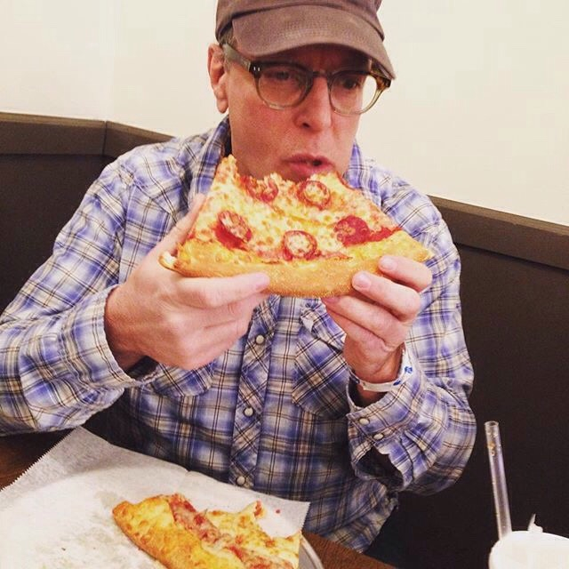 John Chamberlin grabs a slice at Joe and Pie Cafe Pizzaria on Liberty Avenue, Downtown Pittsburgh