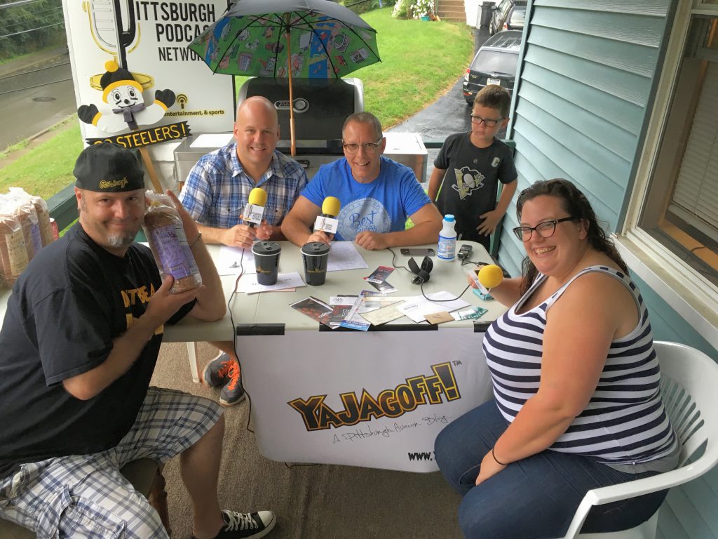 The YaJagoff! Porch Tour continues from Mt. Lebanon as co-hosts John Chamberlin (center) and Craig Tumas (back left) take over the porch of Steve Fernald (front left) and Amanda Narcisi (front right)! Craig's youngest son, Cole (back right) is trying to keep his distance from the ScareHouse zombies right off camera...