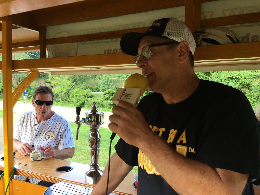 YaJagoff! co-host John Chamberlin is on the Pittsburgh Party Pedaler at the Yinzer 5K. Comedian John Knight, the YaJagoff! field reporter, is catching a ride at the Party Pedal bar...